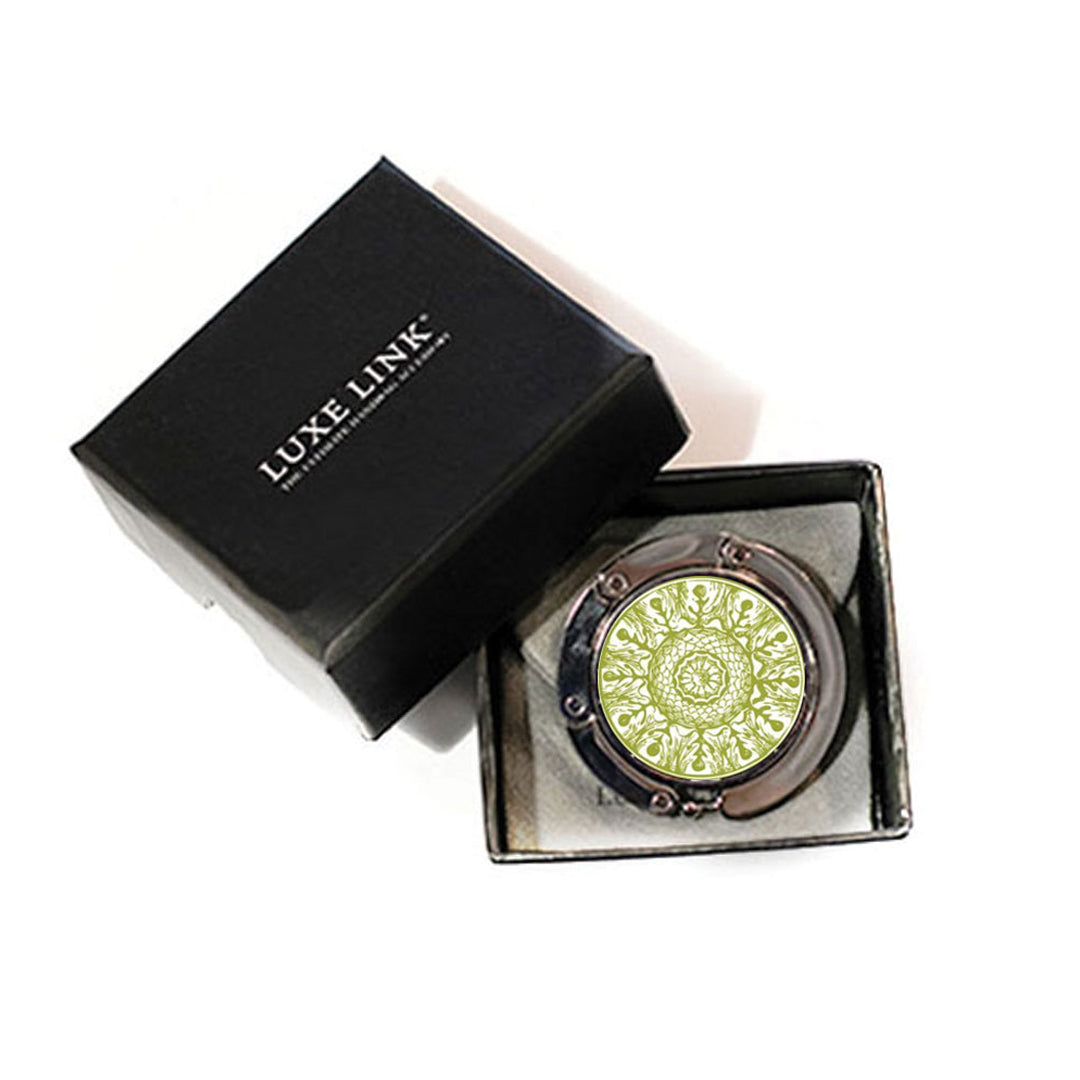 A Luxe Link hook in its open black gift box